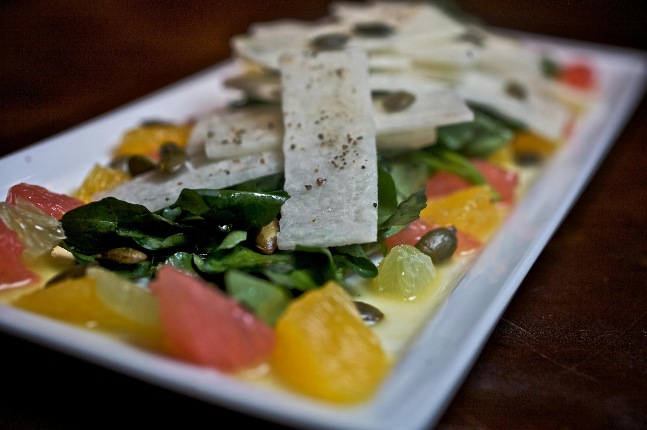 A small plate item on Barrio's menu is their Jicama and Citrus salad with pumpkin seeds and tequila-orange vinaigrette.