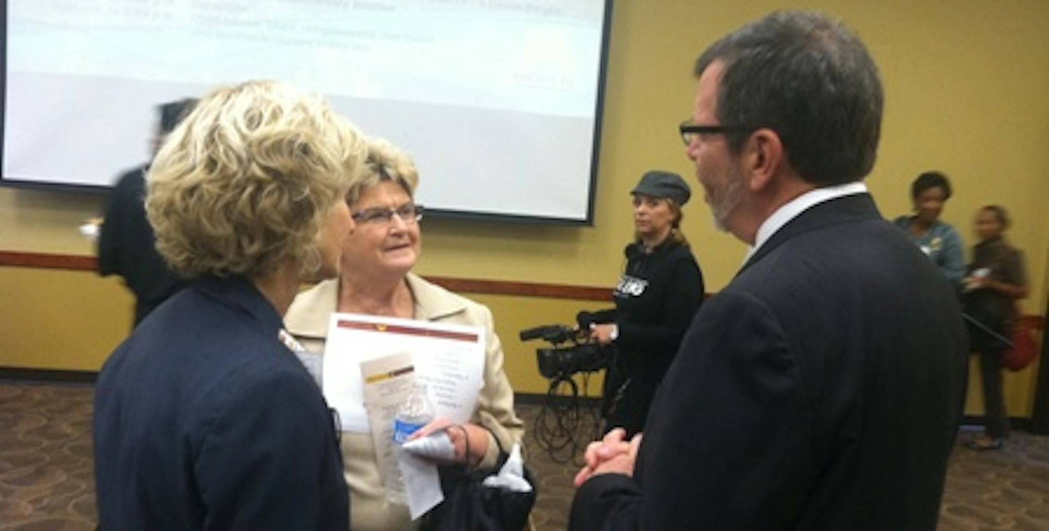 City Council members Diane Hofstede and Barb Johnson chat with U prez Eric Kaler