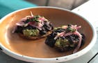 At Hola Arepa, tostones come with shredded beef or a vegan guacamole-black bean version. Nicole Hvidsten, Star Tribune