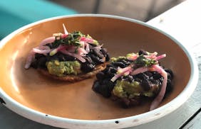 At Hola Arepa, tostones come with shredded beef or a vegan guacamole-black bean version. Nicole Hvidsten, Star Tribune