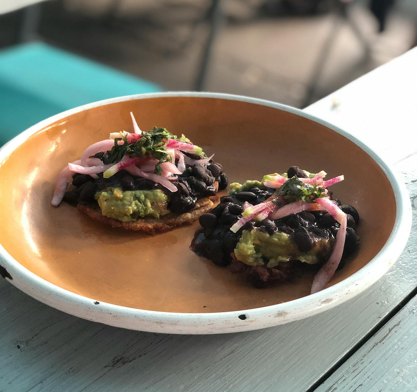 At Hola Arepa, tostones come with shredded beef or a vegan guacamole-black bean version. Nicole Hvidsten, Star Tribune