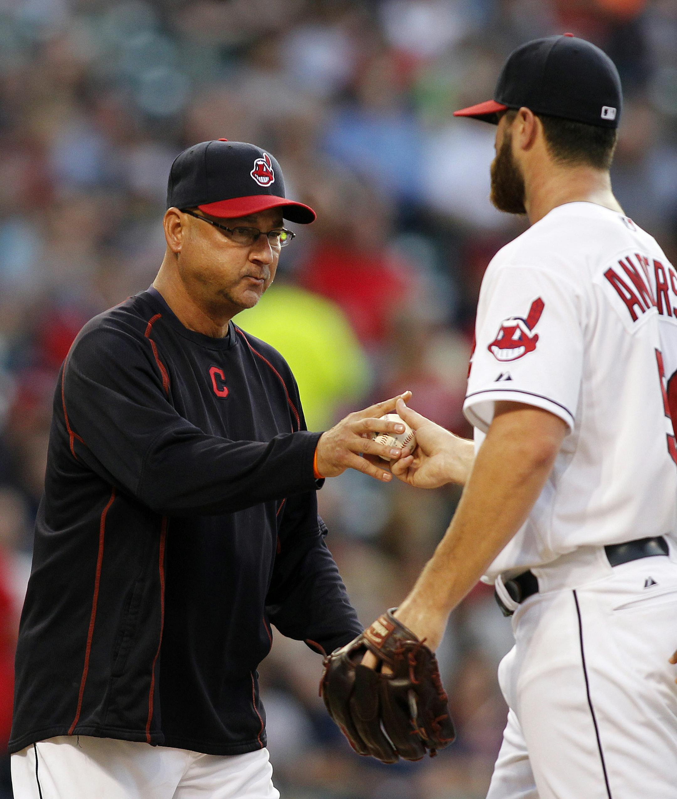 Cleveland Indians manager Terry Francona, left, takes the ball from starting pitcher Cody Anderson who leaves a baseball game in the third inning against the Minnesota Twins, Friday, Aug. 7, 2015, in Cleveland. (AP Photo/Aaron Josefczyk)