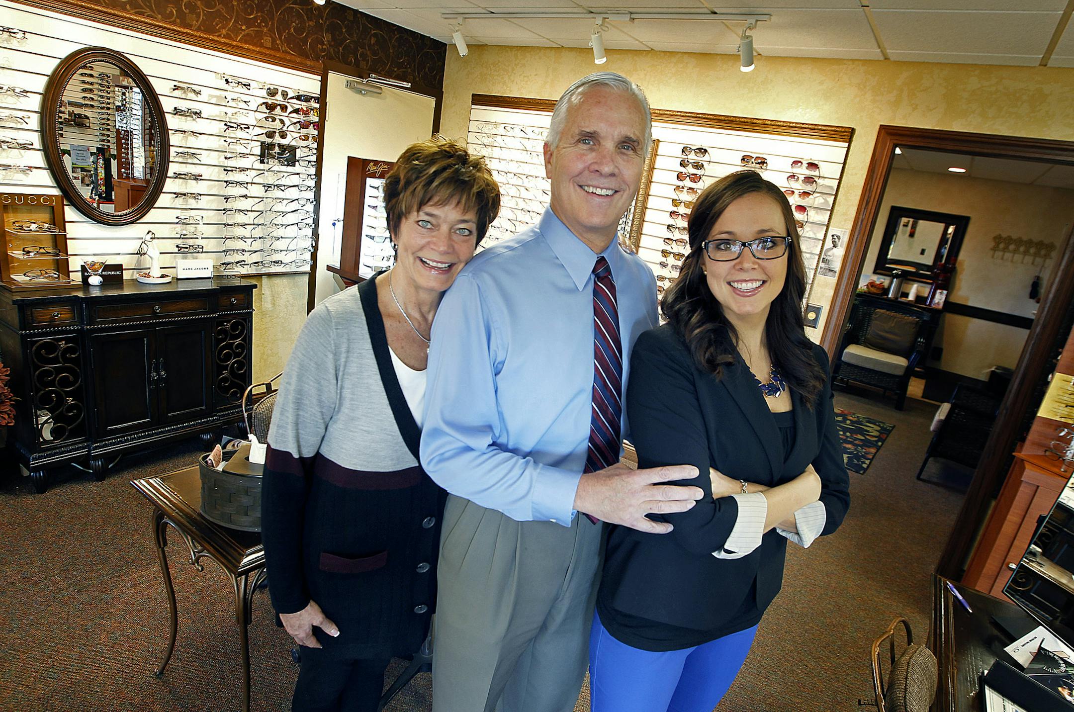 Dr. Tony McDonald stood with his assistants, his wife Patti, the business manager, left, and his daughter Molly McDonald who is also an eye doctor at McDonald Eye Care Wednesday, November 6, 2013 in Lakeville, MN. McDonald Eye Care is one of three Lakeville businesses on County Road 50, all in a row, are all family-owned, with second- or third-generation family members working there. McDonald Eye Care, Lakeville Dental and White Funeral Homes all have children in their 20s and 30s who went to co
