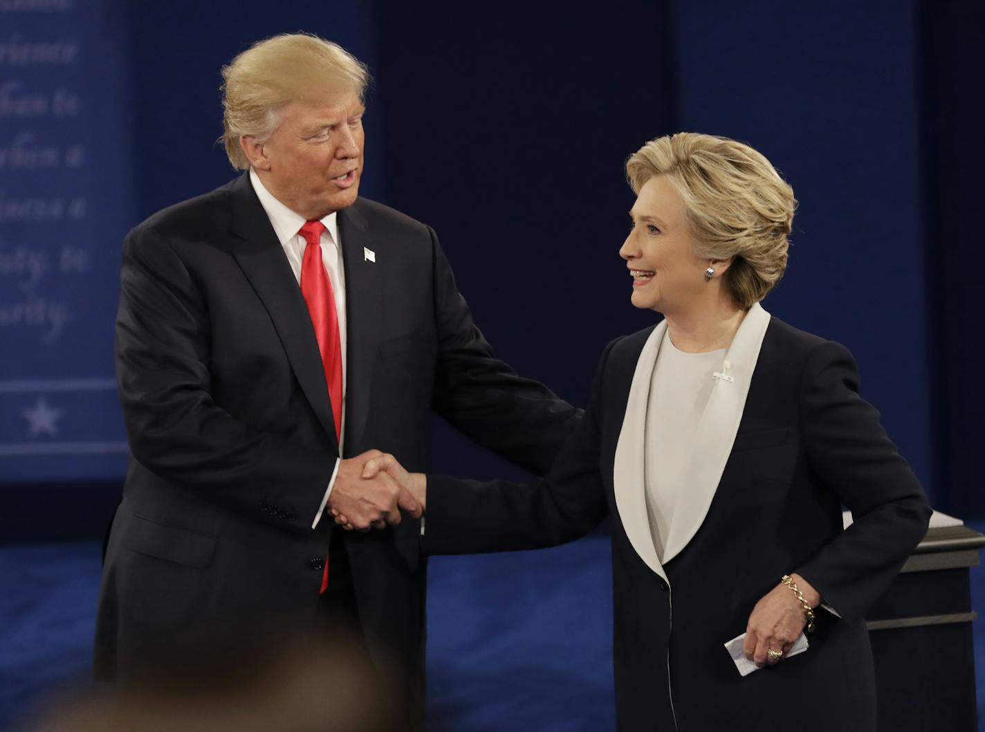 Republican presidential nominee Donald Trump shakes hands with Democratic presidential nominee Hillary Clinton following the second presidential debate at Washington University in St. Louis, Sunday, Oct. 9, 2016. (AP Photo/Patrick Semansky)