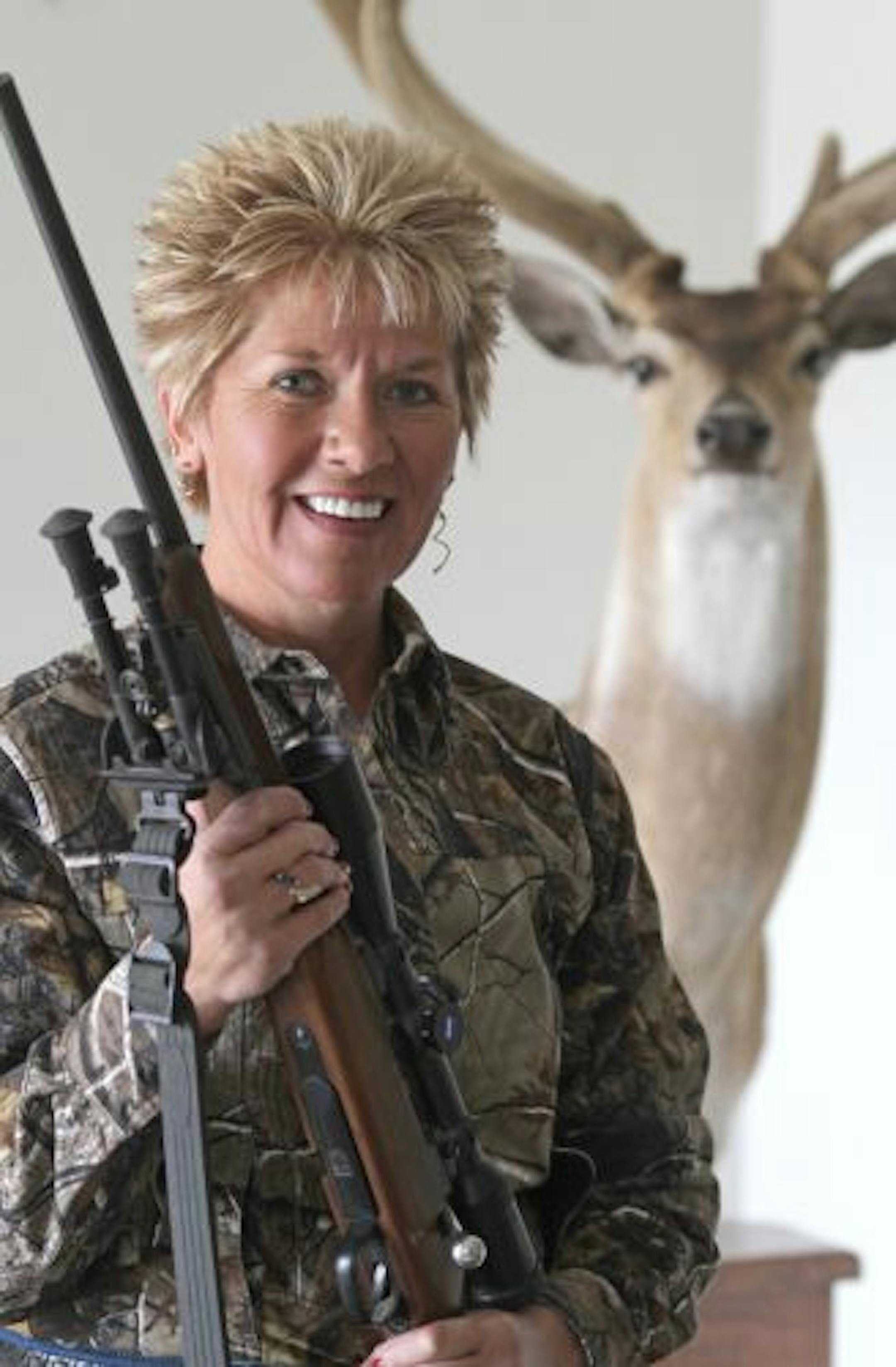 Betty Gaston of Taxidermy Unlimited went to a special shooting school in Texas to learn how to accurately shoot a rifle at long distances. Behind her was an axis deer that shot.