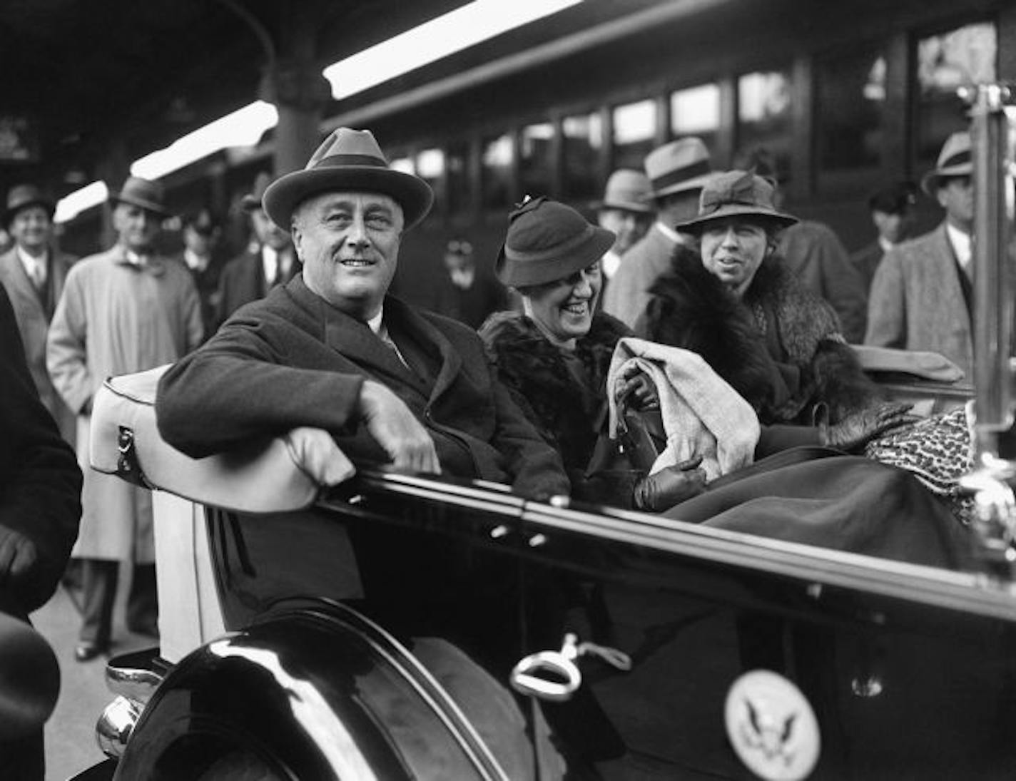 President Franklin D. Roosevelt, his secretary Marguerite LeHand, and first lady Eleanor Roosevelt are shown at Union Station in Washington on their arrival from Warm Springs, Ga., Dec. 4, 1933.