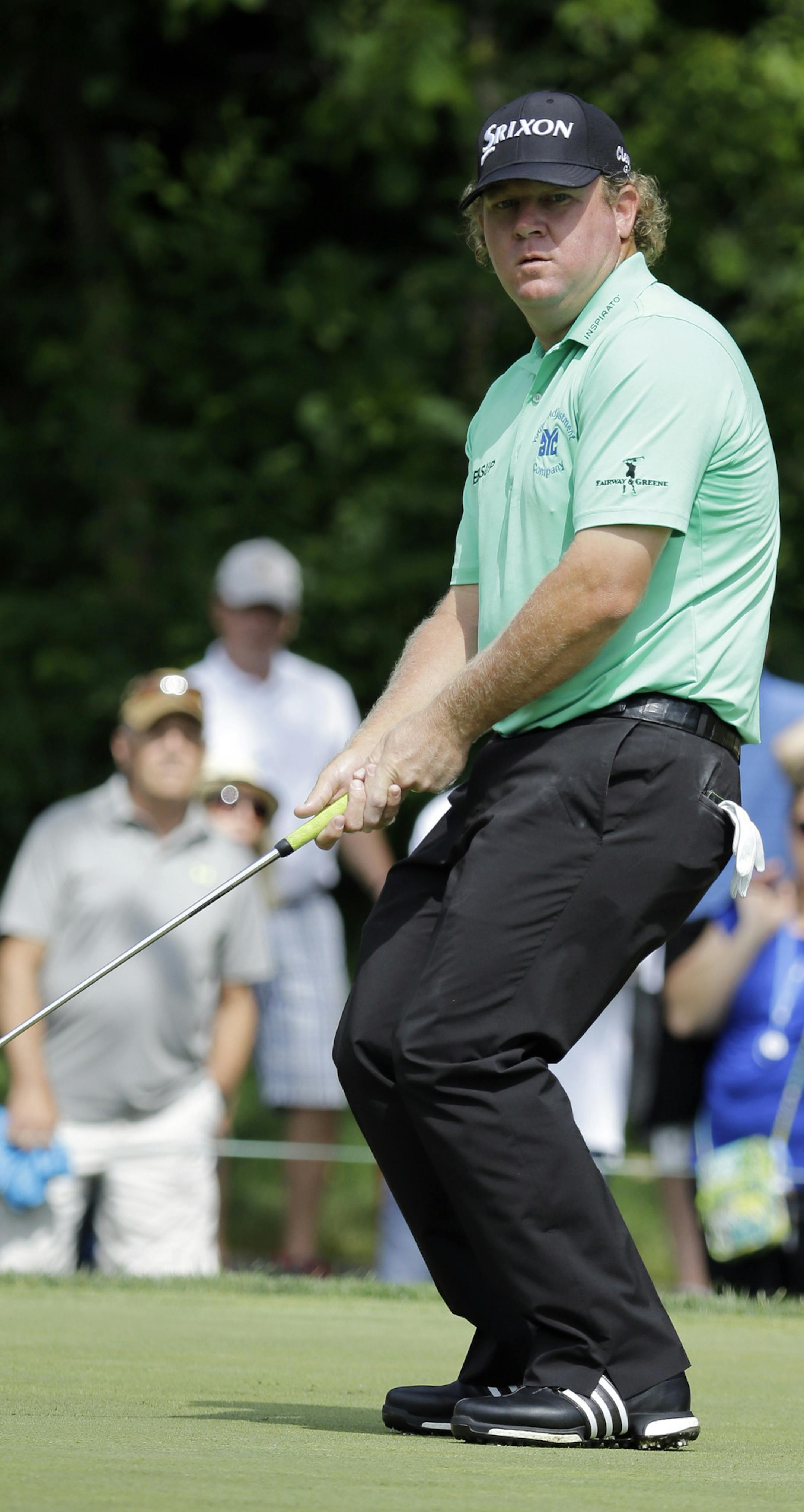 William McGirt watches a putt on the second hole during the final round of the Memorial golf tournament, Sunday, June 5, 2016, in Dublin, Ohio. (AP Photo/Darron Cummings)
