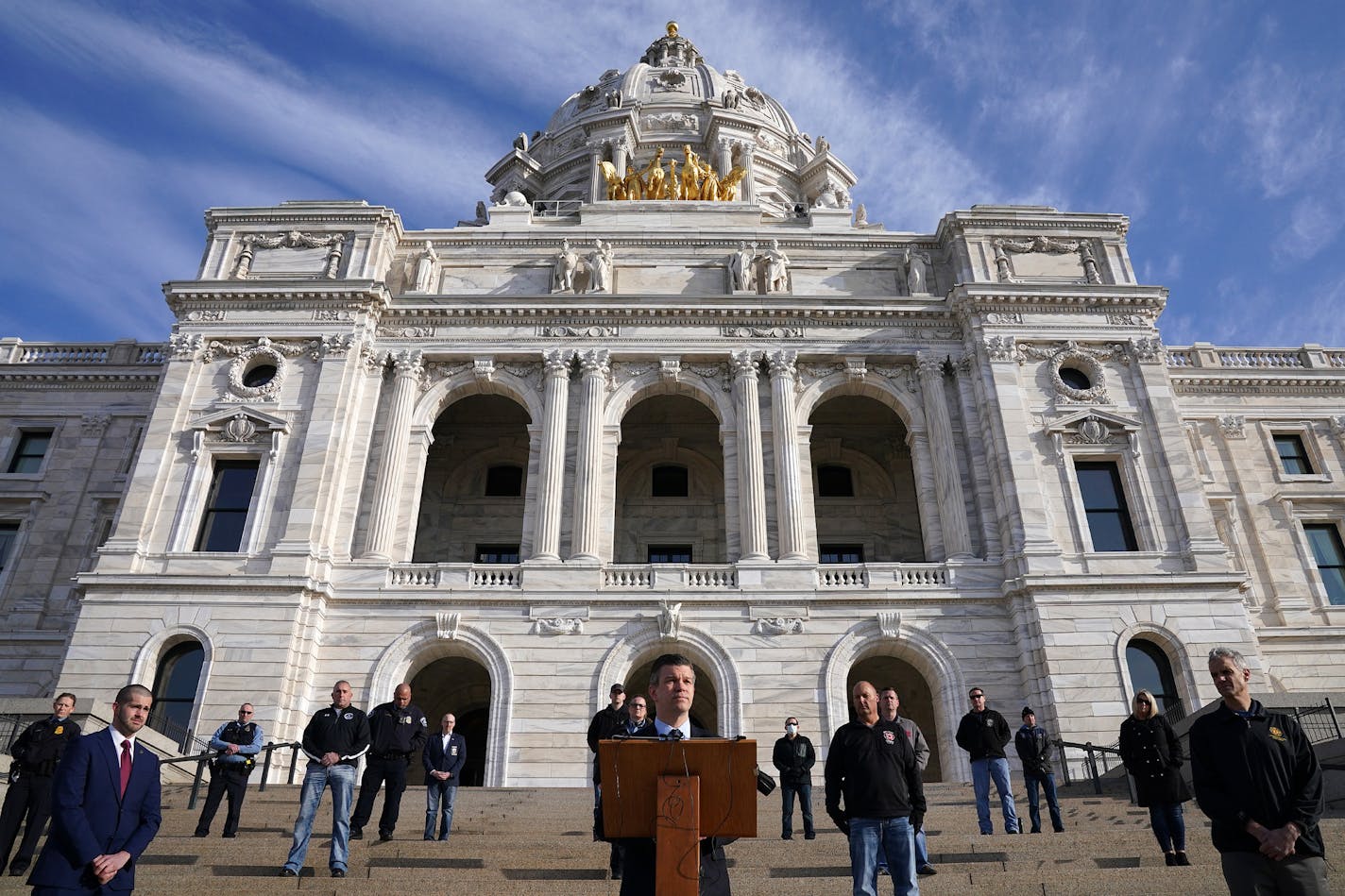 Minnesota House Majority Leader Ryan Winkler spoke with members of the state's emergency response community including firefighters, police officers, nurses, corrections officers and public health workers as they gathered, while observing recommended distancing, on March 26 for a news conference to ask the Legislature to provide them with worker protections.