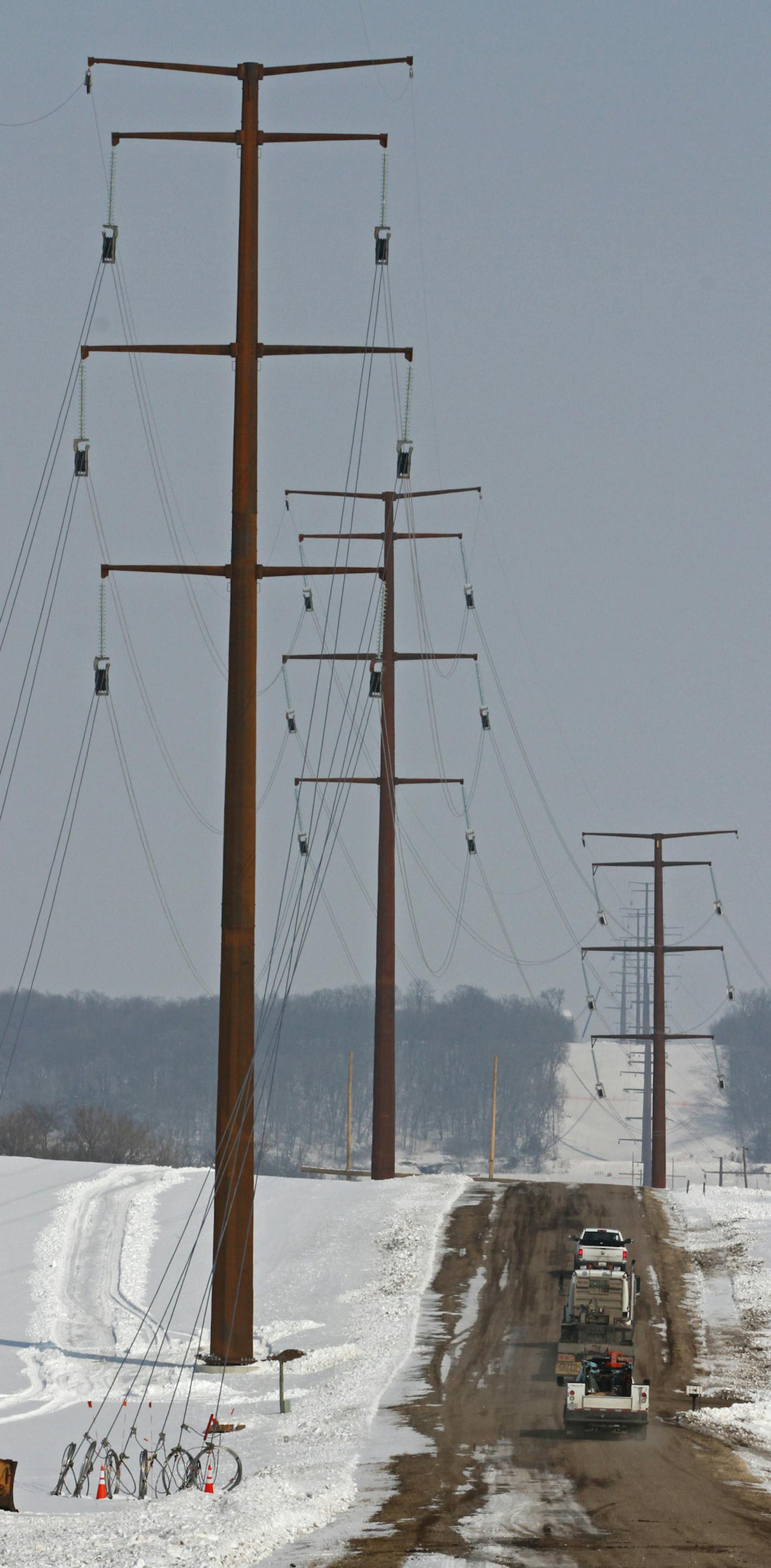 Construction crews strung lines on new power poles not far from Mark Koepp's Bell Plaine farm. Mark Koepp, a hog farmer outside of Belle Plaine, is one of several affected landowners with concerns about the line. Crews have erected five towers on his 134-acre farm, and another seven on nearby land he rents. Construction crews have been disruptive and careless, Koepp said, damaging soil and tile lines with drilling and cement trucks. Koepp said he is not confident he will be repaid for the damage