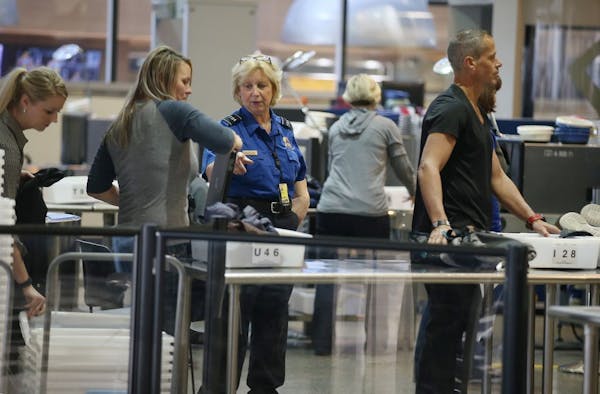 TSA security moved people through as they made their way to the security line at Terminal one at Minneapolis/St. Paul International Airport, Friday, M