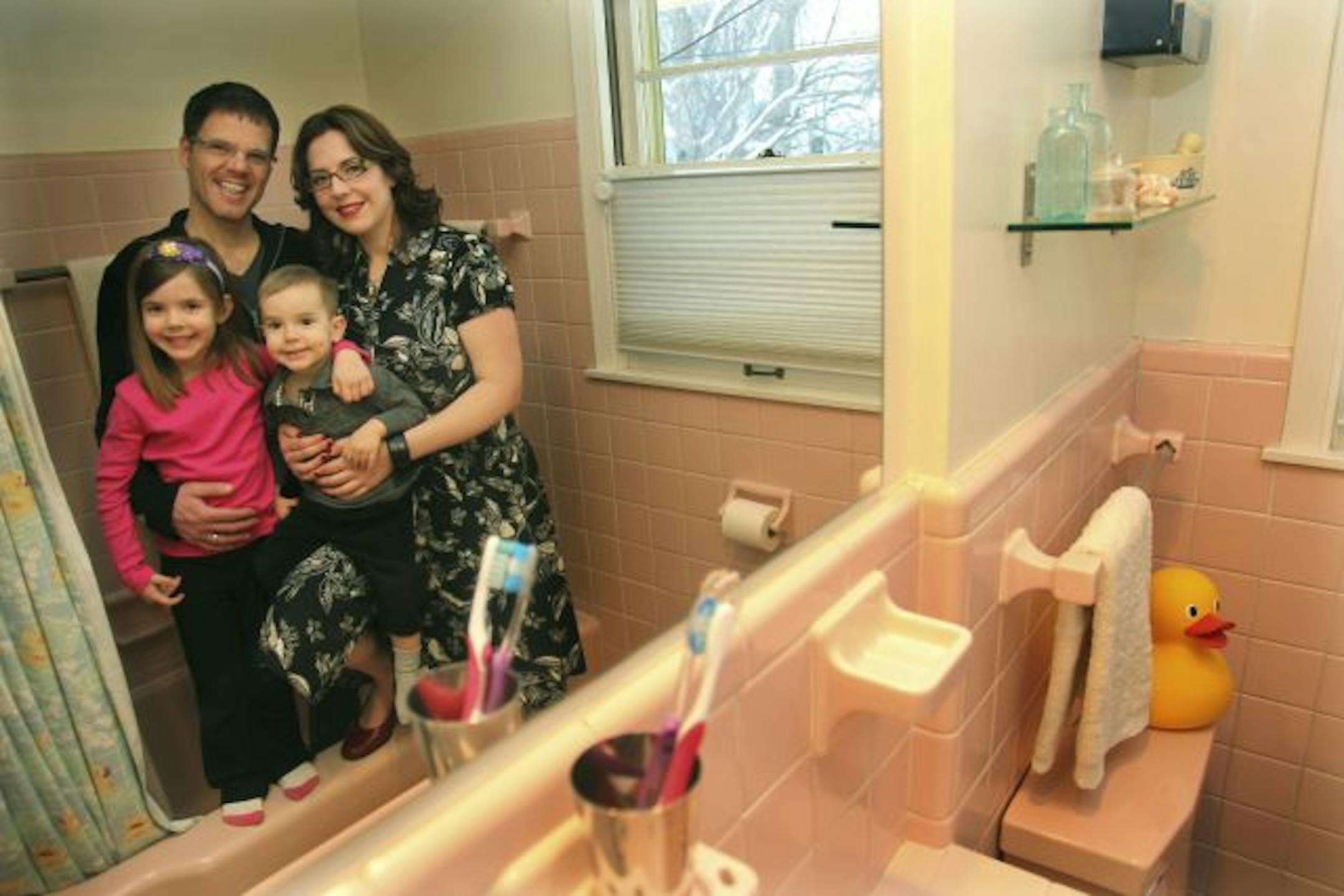 Meghan and Jeremy Wilker, with their children Trixie, 5, and Theo, 2, were happy to find a mid-century home with its original pink bathroom.