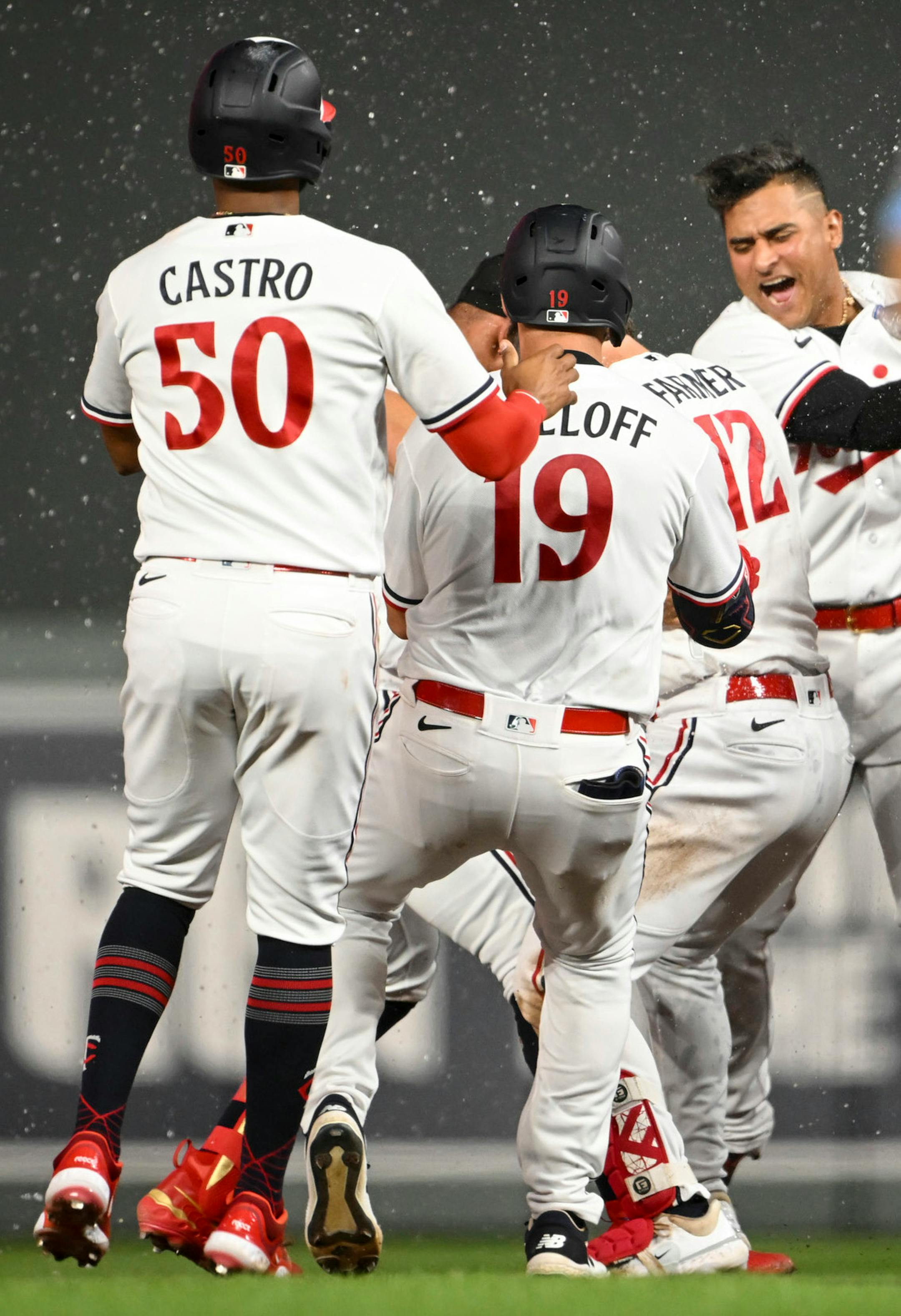 Teammates celebrate with Minnesota Twins third baseman Kyle Farmer (12) after Farmer's walk-off single in the bottom of the 10th inning against the Boston Red Sox Wednesday, June 21, 2023, at Target Field in Minneapolis, Minn.