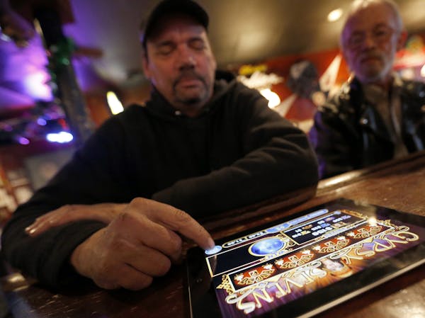 Dec. 12, 2012: Dave Stokes of St. Paul played an electronic pulltab game at Skinner's Pub.