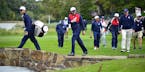 Phil Mickelson waved to fans as he crossed over the Payne Stewart Bridge on the fairway of the 7th hole Tuesday at Hazeltine. ] (AARON LAVINSKY/STAR T