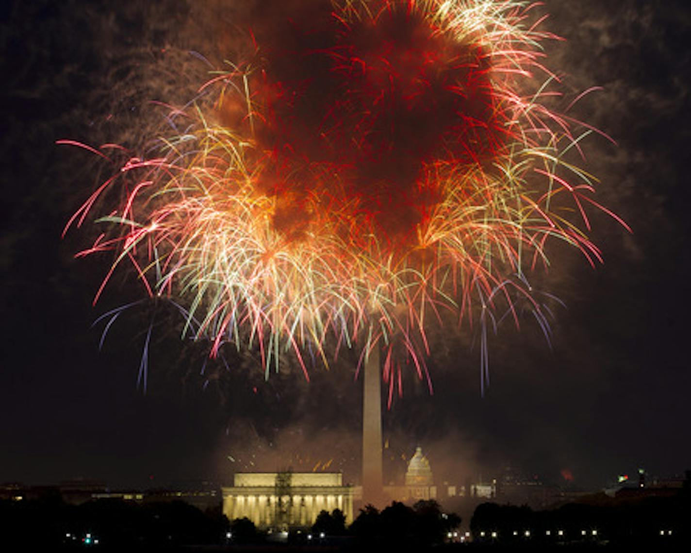 FILE - In this July 4, 2018, file photo, fireworks explode over Lincoln Memorial, Washington Monument and U.S. Capitol, along the National Mall in Washington, during the Fourth of July celebration.