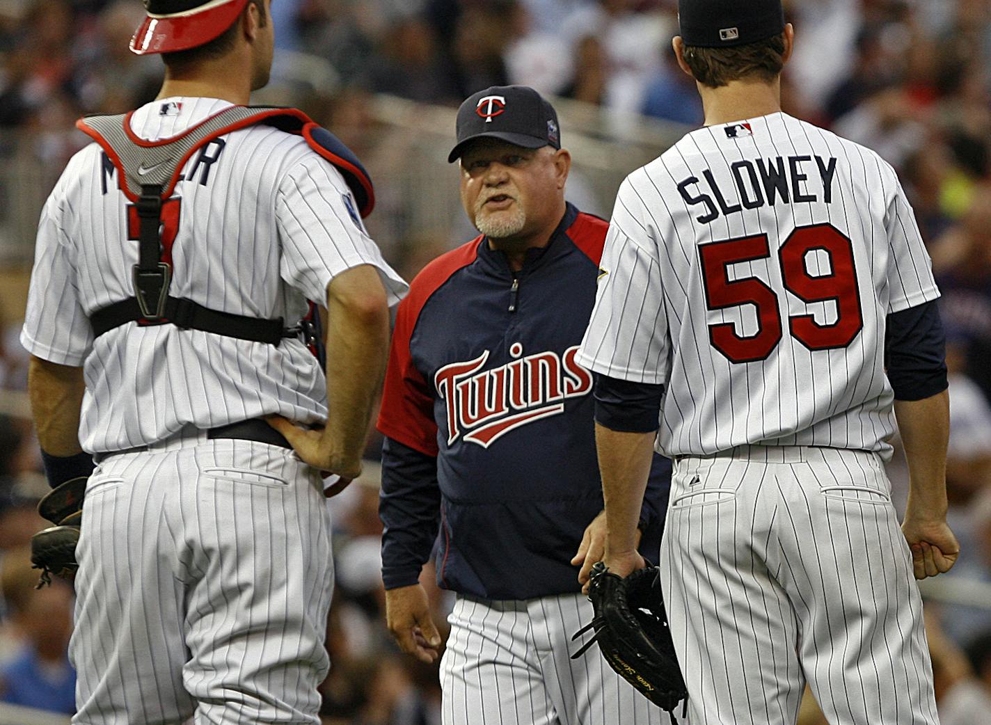JIM GEHRZ &#xa5; jgehrz@startribune.com Minneapolis/May 28 2010/7:10 PM The Minnesota Twins played the Texas Rangers at Target Field Friday, May 28, 2010. IN THIS PHOTO:] Minnesota manager Ron Gardenhire, Joe Mauer and pitcher Kevin Slowey (right) wait for a ruling on Texas&#xd5; Ian Kinsier&#xd5;s hit for what appeared like a home run. The ball was ruled foul in the fourth inning.