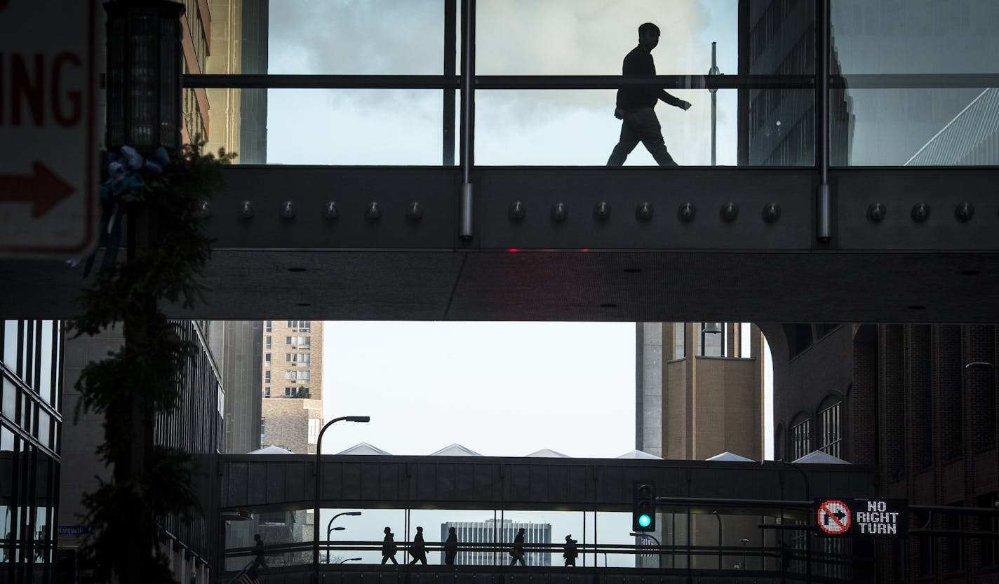 Pedestrians passed over S. 8th Street in downtown Minneapolis. When skyways to the new Wells Fargo buildings and U.S. Bank Stadium open, the system will be nearly 9 miles long.