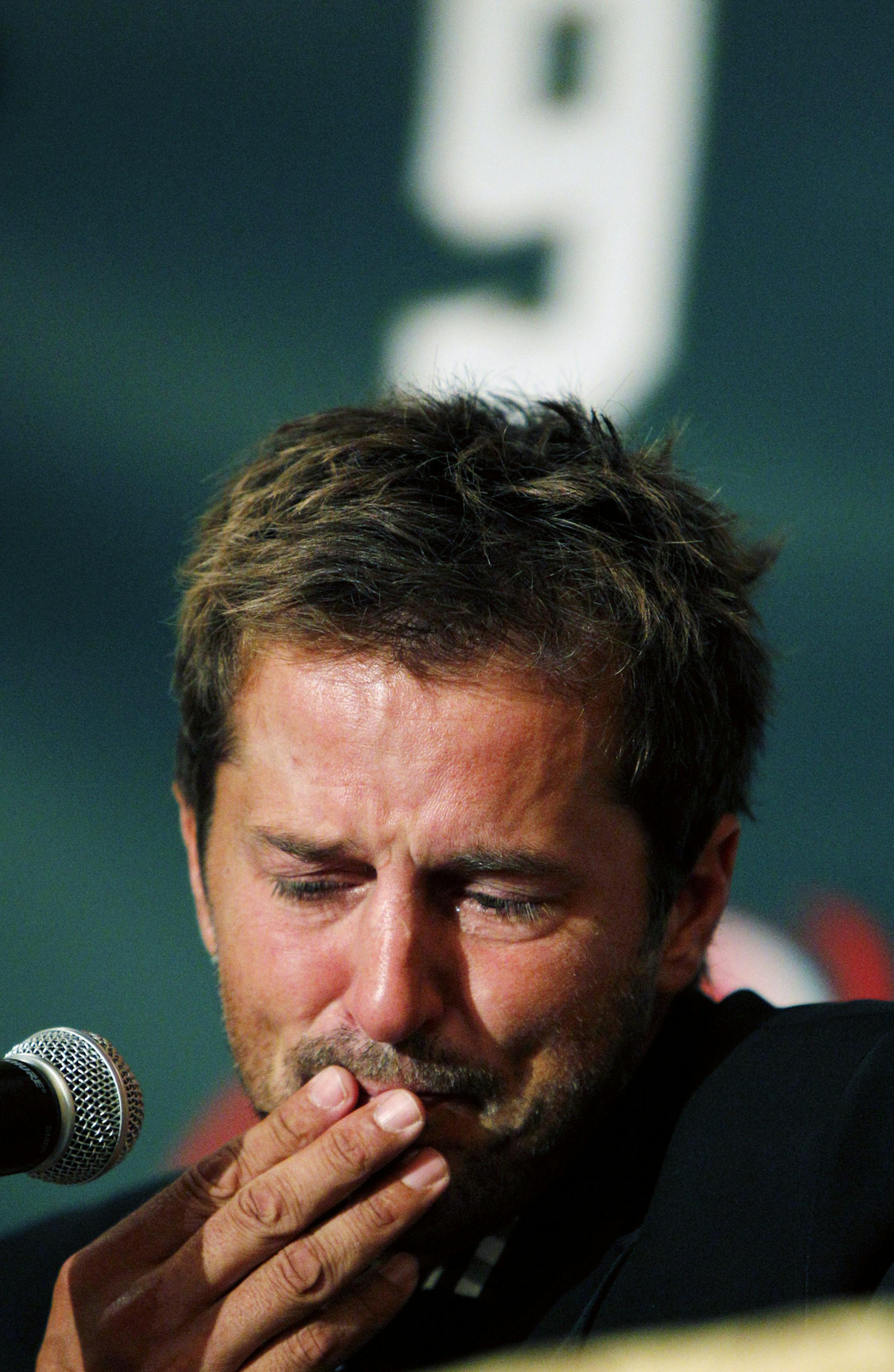 FILE - In this Sept. 23, 2011 file photo NHL hockey player Mike Modano gets choked up during a news conference announcing his retirement in Dallas. Modano had several tearful farewells as his playing days wound down. The guy who made hockey cool in Dallas figures he'll get emotional again for the final ceremony: retiring his iconic No. 9 during the Dallas Stars' game against Minnesota on Saturday, March 8. (AP Photo/LM Otero, File)