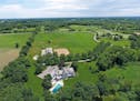 This estate in Hamel comes with 25 acres of land.