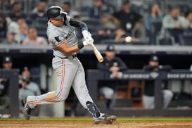 The Twins' Royce Lewis hits a home run against the Yankees during the seventh inning Tuesday in New York.