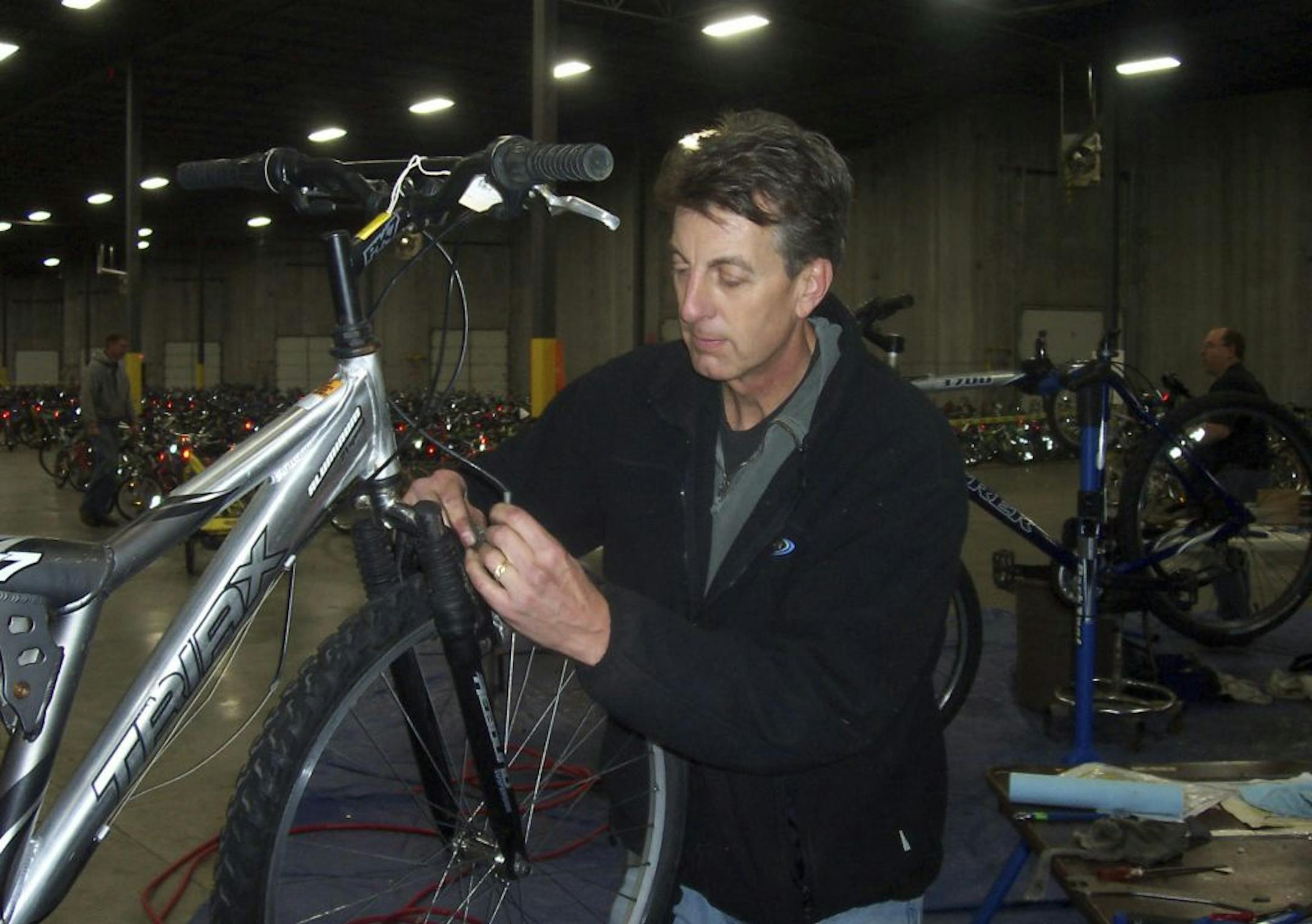 Volunteer Mark Hoffman of Plymouth worked on one of the 5,000 bikes.