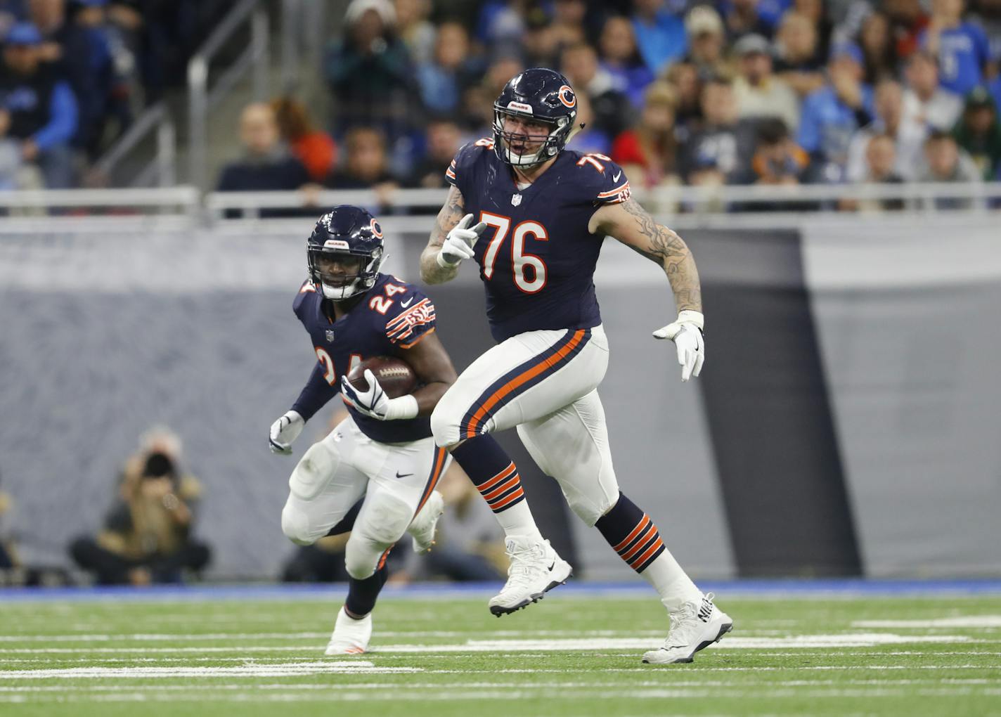 Chicago Bears offensive guard Tom Compton (76) blocks for Jordan Howard (24) against the Detroit Lions during an NFL football game in Detroit, Saturday, Dec. 16, 2017. (AP Photo/Paul Sancya) ORG XMIT: MIPS10