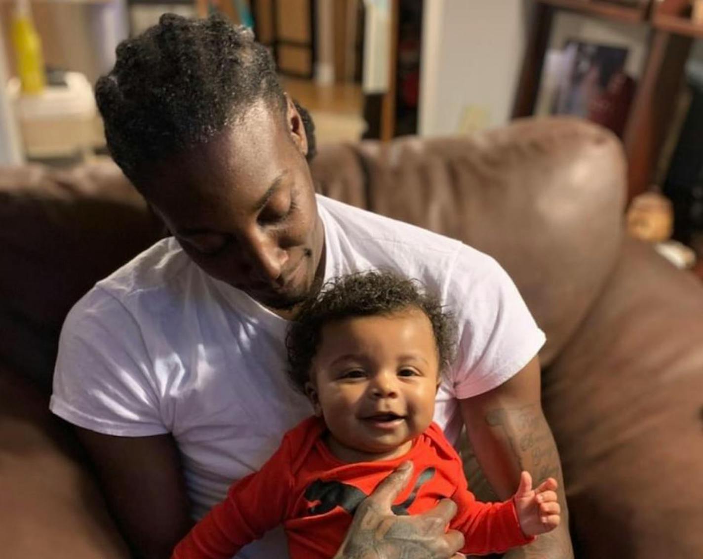 Imez Wright with his baby son.