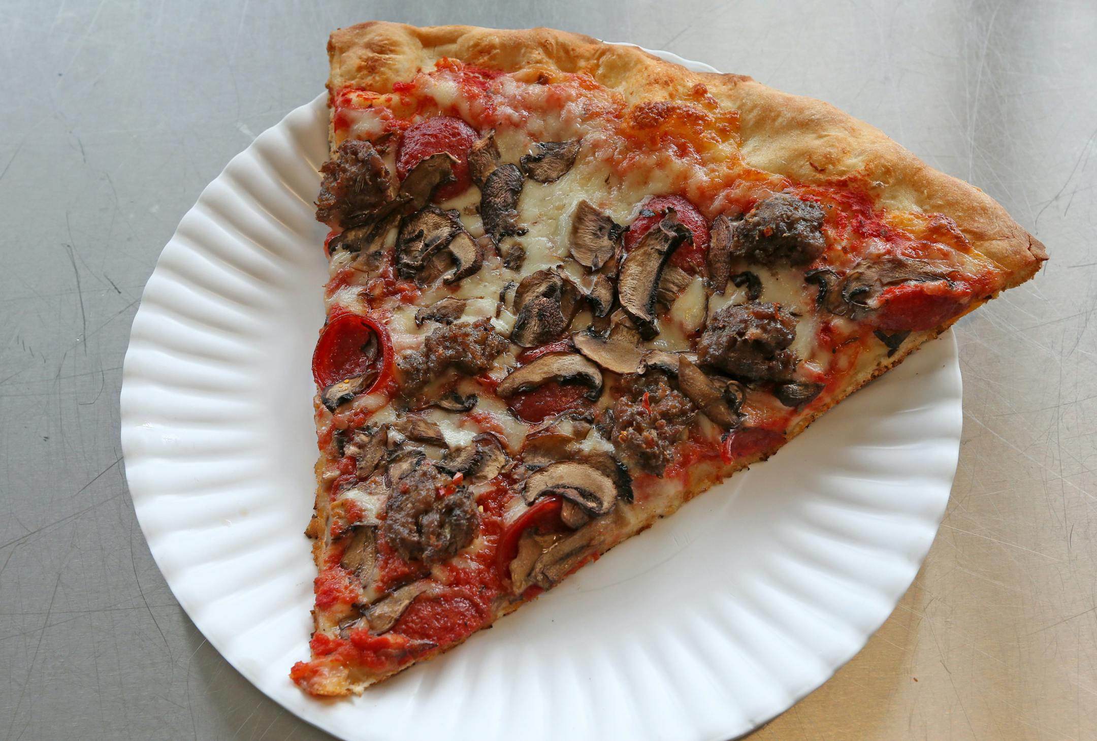 Hello Trinity, fennel sausage, pepperoni and drimini mushroom pizza at Hello Pizza in Edina, photographed on 6/28/13.] Bruce Bisping/Star Tribune.com bbisping@startribune.com