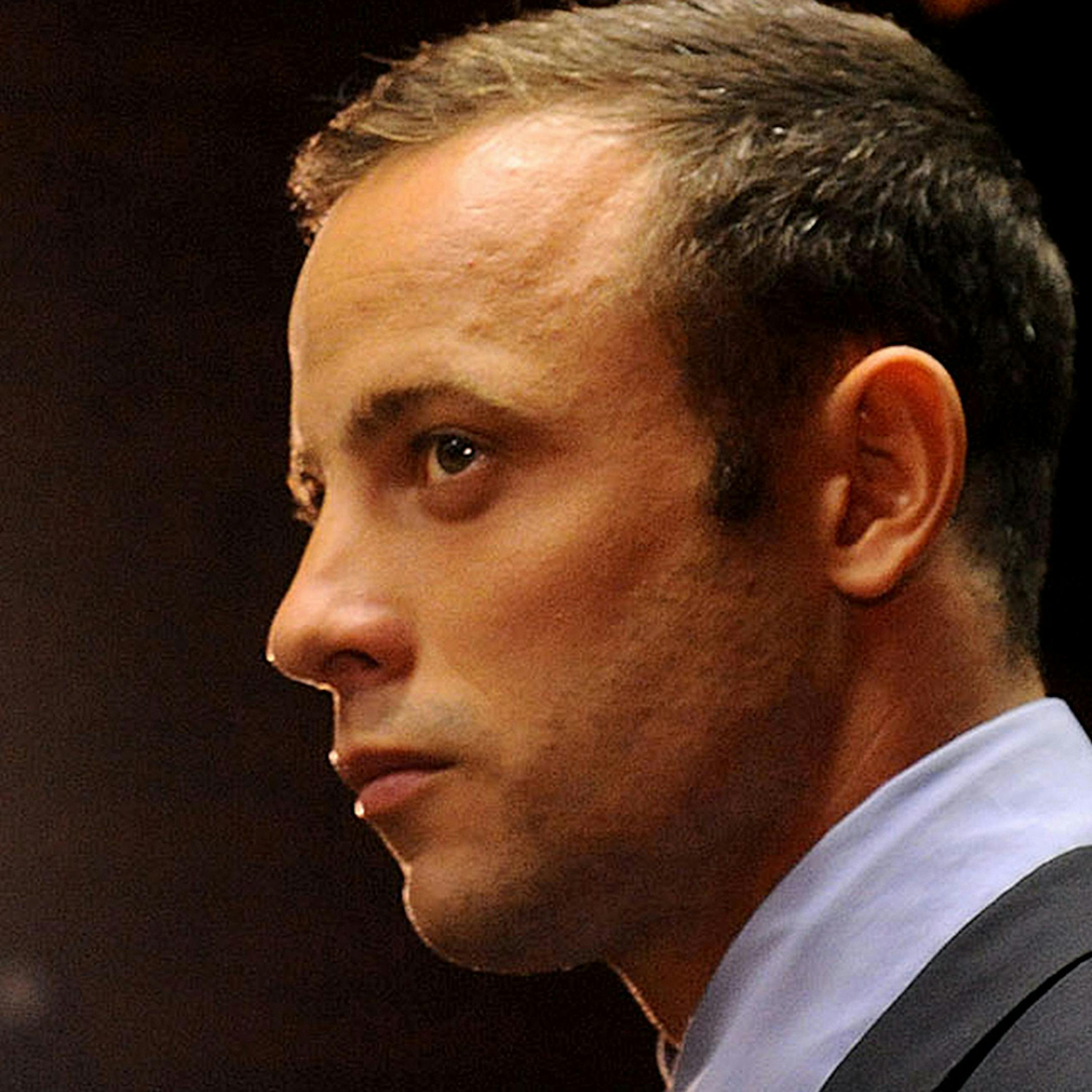 FILE - In this Friday, Feb. 22, 2013 file photo Olympic athlete Oscar Pistorius stands in the dock during his bail hearing at the magistrates court in Pretoria, South Africa. Pistorius is scheduled to re-appear in a South African court on Monday Aug.19, 2013. The the 26-year-old double-amputee Olympian will be indicted on a main charge of premeditated murder of his his girlfriend, Reeva Steenkamp. According to reports Sunday Aug.18, prosecutors have confirmed they will maintain the charge they i