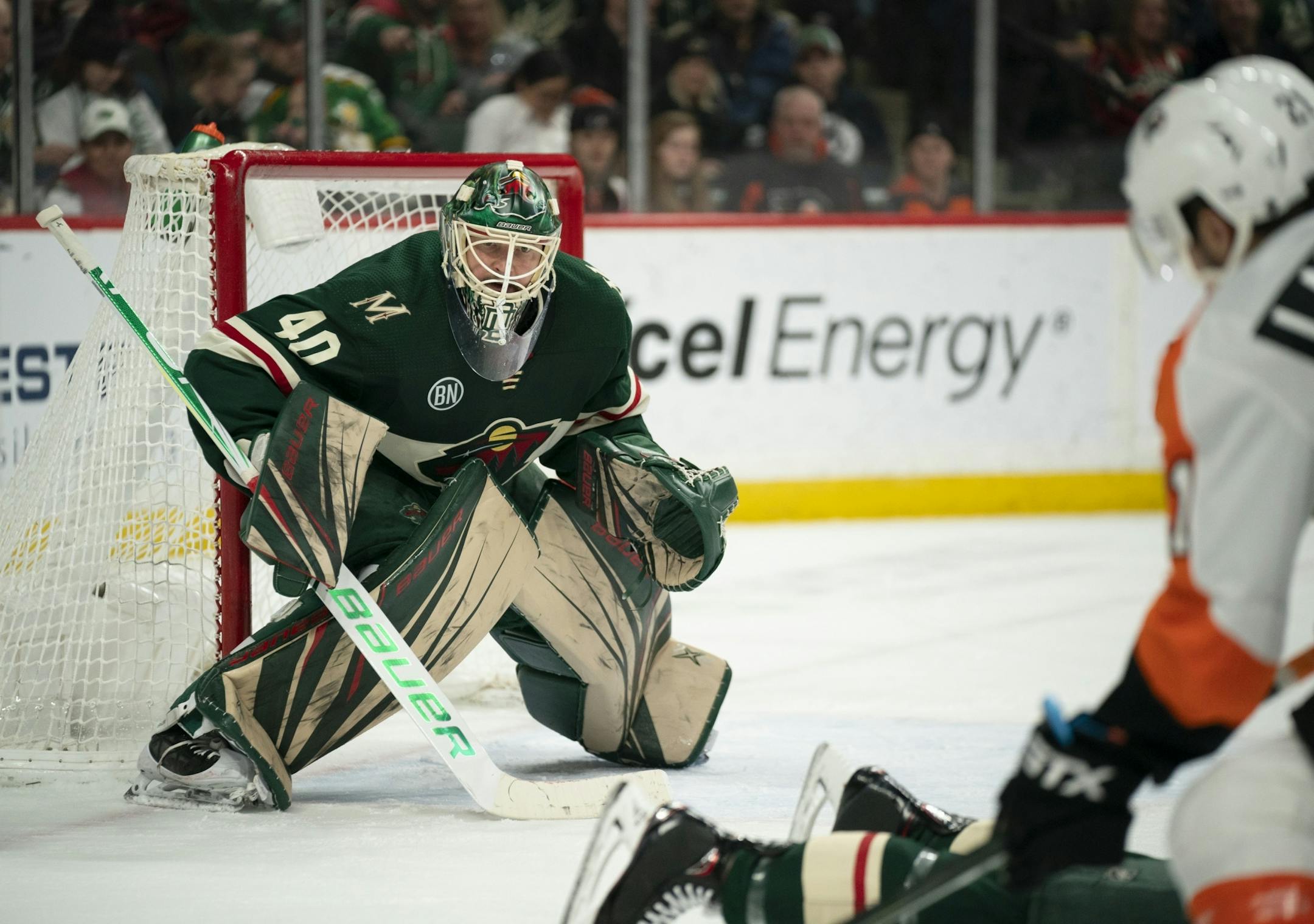 Minnesota Wild goaltender Devan Dubnyk (40) eyed Philadelphia Flyers center Scott Laughton (21) as he lined up a second period shot.