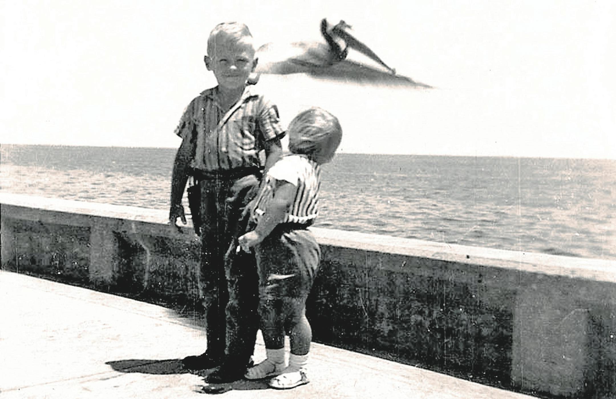 We're hoping these unknown children enjoyed their day at the beach with the giant looming bird.