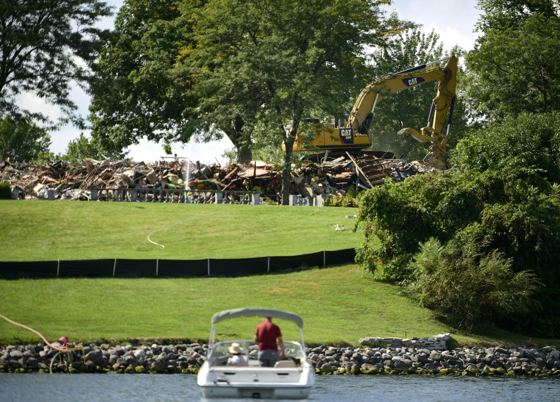Partners Valerie O'Connor and Dave Sturgeon, of Lafayette Bay, pulled up along the shore near the just-demolished Pillsbury Mansion Wednesday on Lake Minnetonka. " We've been going by here for 30 years looking at this property," Sturgeon said. "It's a shame to see it gone."