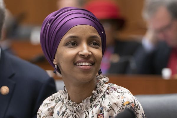 Rep. Ilhan Omar, D-Minn., sits with fellow Democrats on the House Education and Labor Committee during a bill markup, on Capitol Hill in Washington, W