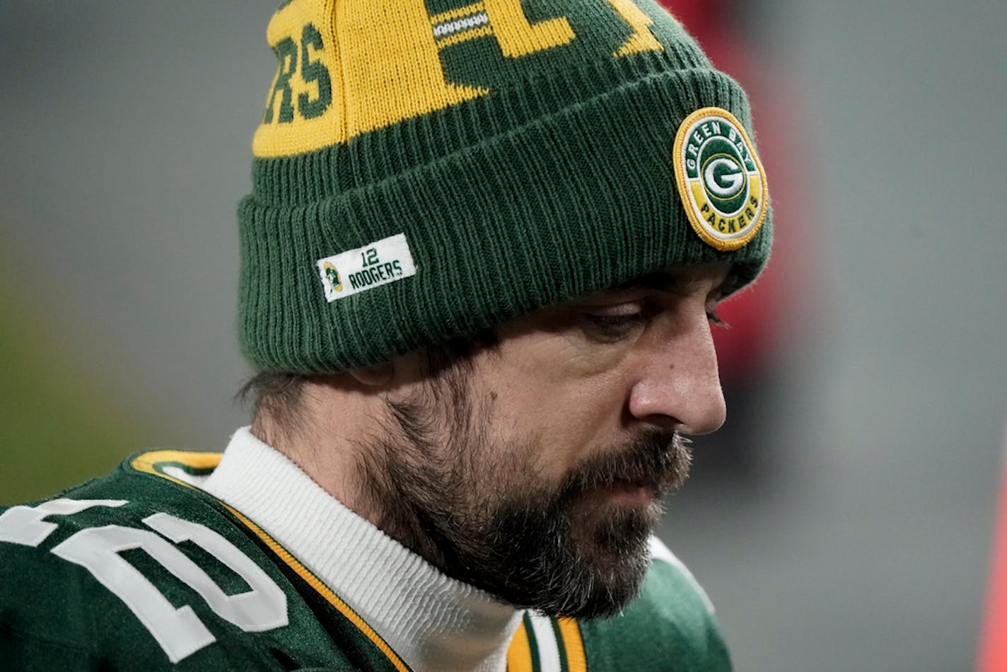 Aaron Rodgers walks off the field after the NFC championship game loss to Tampa Bay.