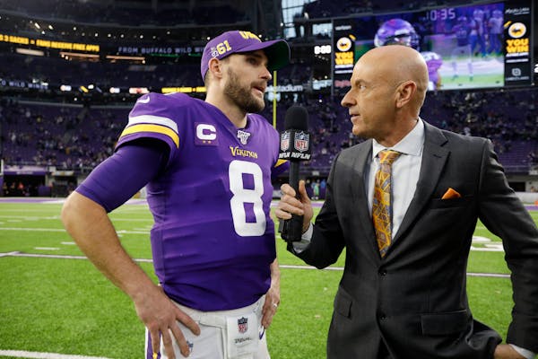 NFL Network reporter Randy Moss interviews Vikings quarterback Kirk Cousins