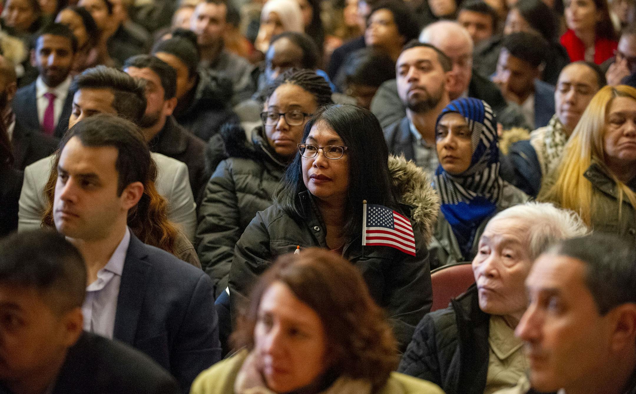 Petitioners from all over the world listen to speakers as the ceremony begins during a naturalization ceremony at the Lowell Auditorium where 633 immigrants became US citizens on January 22, 2019 in Lowell, Massachusetts. (Joseph Prezioso/AFP/Getty Images/TNS) **FOR USE WITH THIS STORY ONLY**
