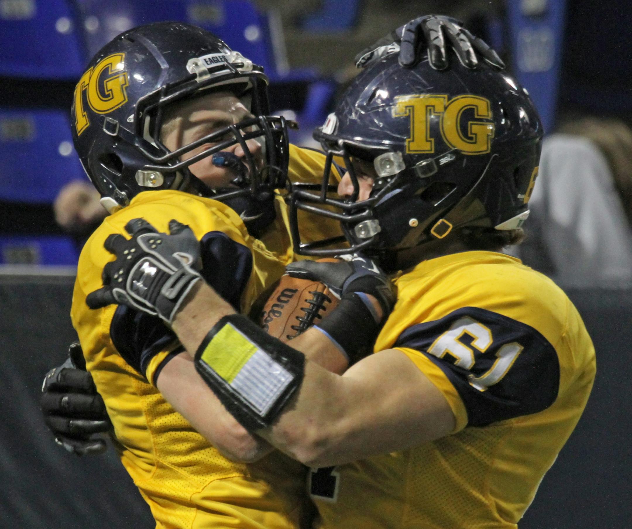 Minnesota Prep Bowl Finals, Class 5A, Totino-Grace vs. Owatonna, 11/24/12, played at the Metrodome. (left to right) Totino-Grace's Charlie Miller celebrated his touchdown with Zach Moser.