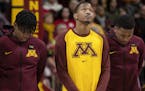 Gophers guard Dupree McBrayer looked up after a moment of silence to honor his mother Tayra McFarlane who passed away earlier this week. ] CARLOS GONZ