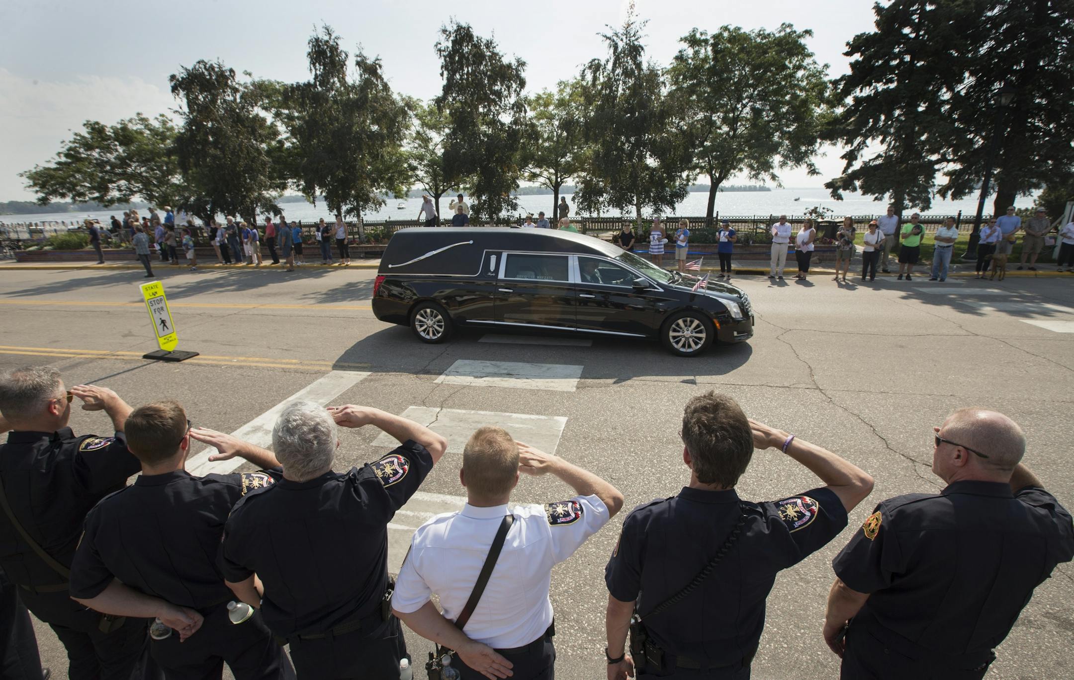 The funeral processions for Wayzata Police Officer Bill Mathews passed by Lake Minnetonka to Summit Park Cemetery were he will be buried Thursday September 14,2017 in Wayzata, MN.