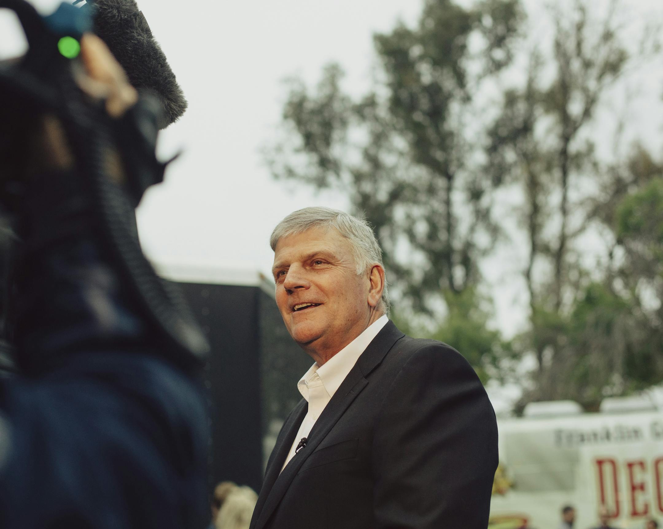 Franklin Graham, the son of the late Billy Graham, speaks with reporters backstage at his Decision America California Tour kickoff in Escondido, Calif., May 20, 2018. Graham is leading a three-bus caravan up the middle of the state, one of the biggest political battlegrounds this year, to urge evangelicals to vote and to win California for Jesus. (Rozette Rago/The New York Times)