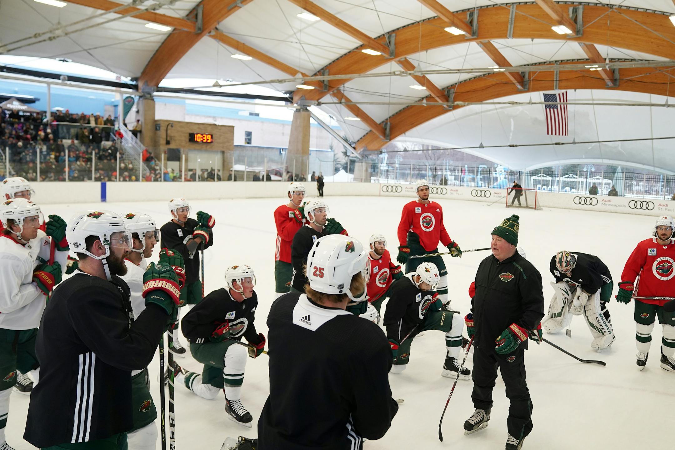 Minnesota Wild head coach Bruce Boudreau talked with his team on the ice during the Wild's outdoor practice Thursday.