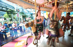 Elizabeth "Betty" Weinlick spoke with her daughter, Emily, while riding the carousel at Mall of America at the ceremony commemorating Elizabeth and he