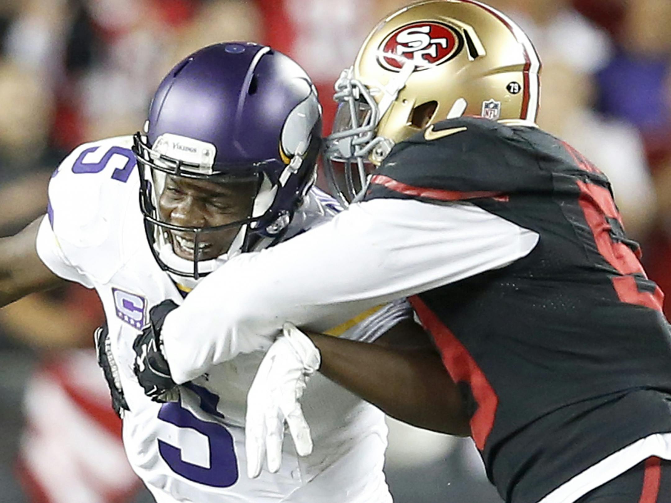 Minnesota Vikings quarterback Teddy Bridgewater (5) was sacked by Aaron Lynch (59) in the fourth quarter of Monday's season-opener in San Francisco.