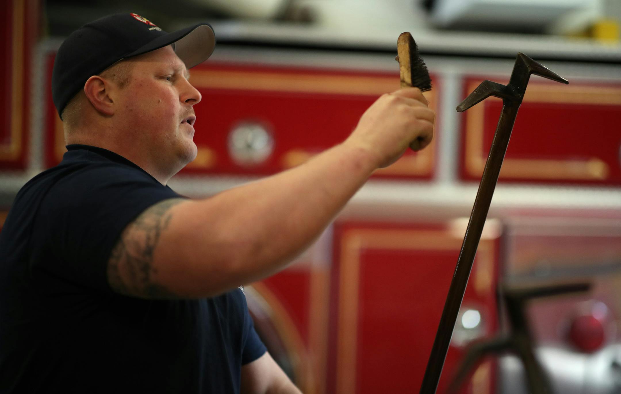 Dustin Pedersen fire fighter,cleaned a fire hook during an inspection and cleaning at the fire station 3 on Upper 55th street Thursday October 11, 2018 in Inver Grove Heights, MN. ] JERRY HOLT ï jerry.holt@startribune.com