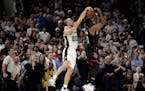 San Antonio Spurs' Manu Ginobili (20) of Argentina blocks Houston Rockets' James Harden three-point shot attempt in the final seconds of overtime of G