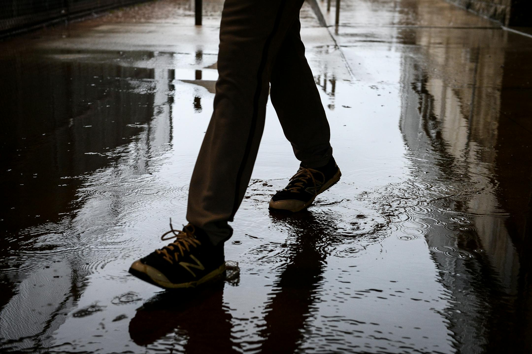 A Twins player walked through a puddle Wednesday morning on the way to the bullpen. Rain moved practice into the batting cages and the covered portion of the bullpen.