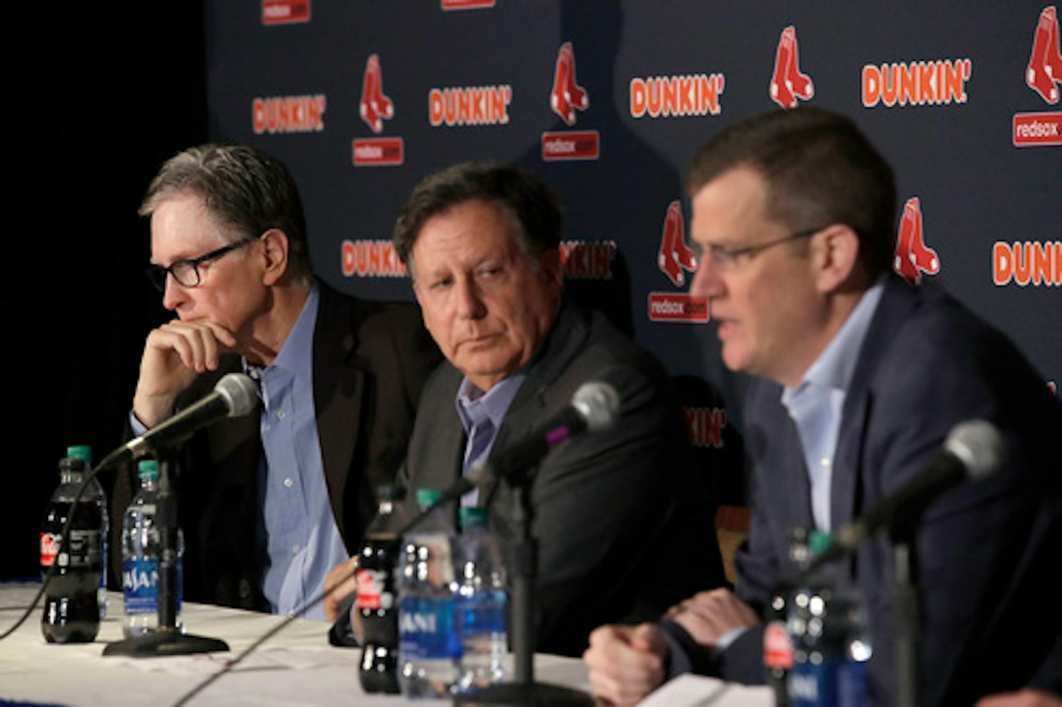 From left, Boston Red Sox owner John Henry, chairman Tom Werner and CEO Sam Kennedy participate in a news conference at Fenway Park, Wednesday, Jan. 15, 2020, in Boston. The Boston Red Sox have parted ways with manager Alex Cora, with the move coming one day after baseball Commissioner Rob Manfred named him as a ringleader with Houston in the sport's sign-stealing scandal. (AP Photo/Elise Amendola)