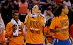 West's Diana Taurasi, of the Phoenix Mercury, applauds as time expires after the WNBA All-Star basketball game, Saturday, July 19, 2014, in Phoenix. T