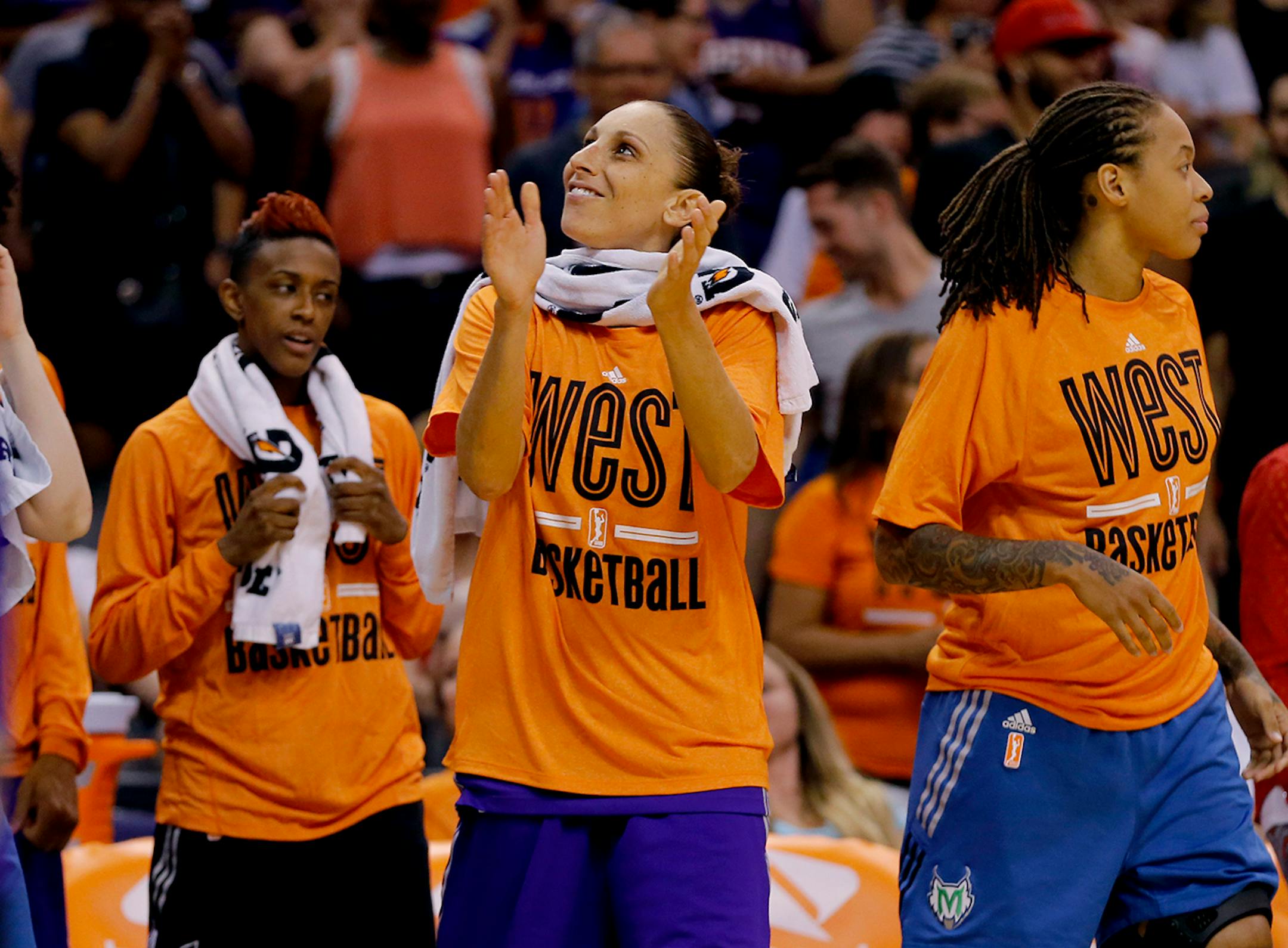 West's Diana Taurasi, of the Phoenix Mercury, applauds as time expires after the WNBA All-Star basketball game, Saturday, July 19, 2014, in Phoenix. Taurasi will skip the 2015 WNBA season to rest for her European season.