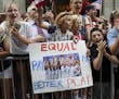 Fans and players celebrate the U.S. Women's Soccer Team winning the 2019 World Cup during a 'Canyon of Heroes' ticker tape parade in Lower Manhattan